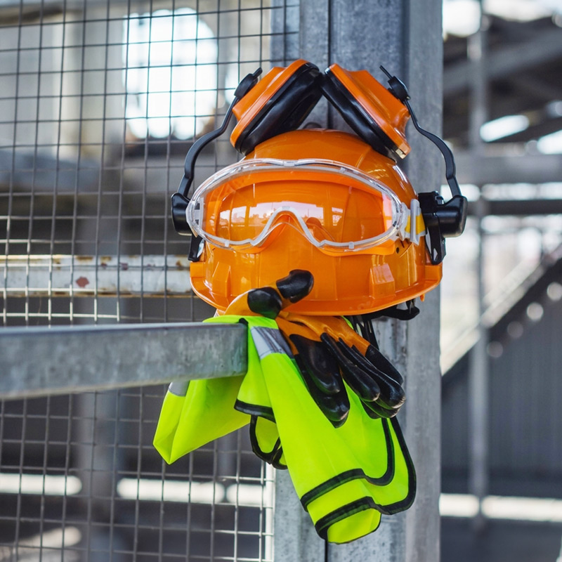 Industrial worker wearing personal protective equipment in a factory setting